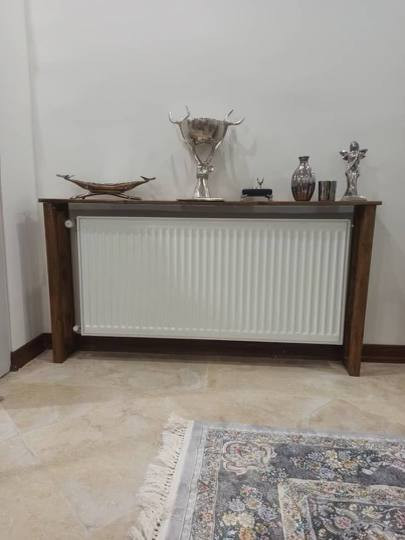 عکس ارسالی مشتری از کاور شوفاژ چوبی در کنج منزل
