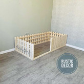 تخت خواب نوزاد مونته سوری از نمای بغل با نرده حصاری