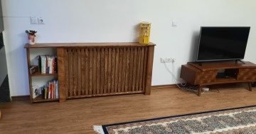 عکس ارسالی مشتری از کاور شوفاژ چوبی کنار میز تلویزیون